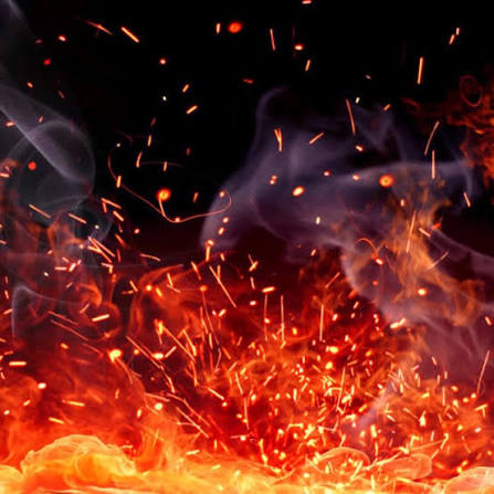 Glowing embers rising through the night